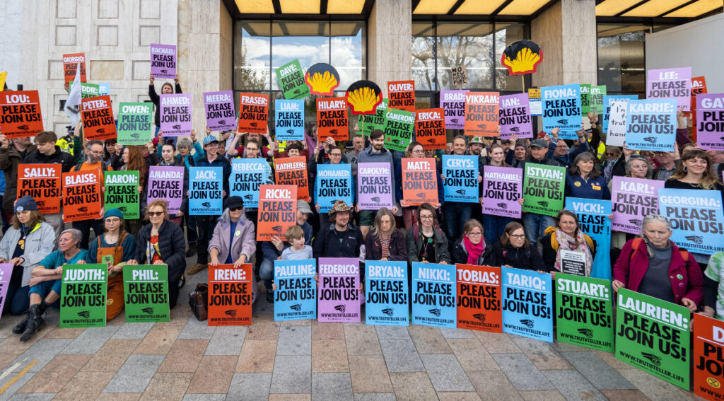 Banners calling Shell executive to join Extinction Rebellion