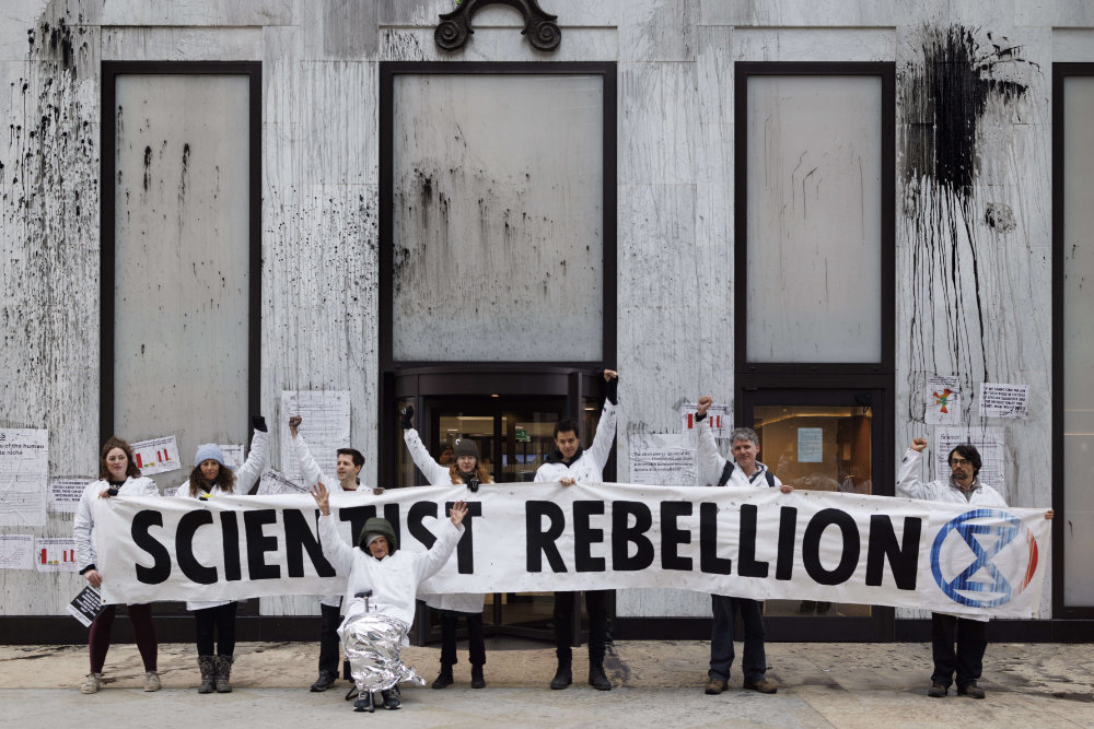 6th April 2022, Scientists from Extinction Rebellion flypost Shell's London HQ with scientific papers on climate change