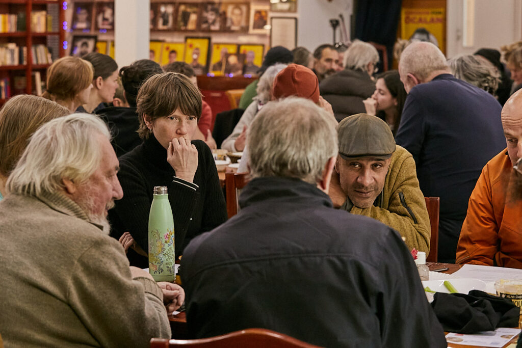 People discussing local issues at a community assembly in Haringey, London in November 2023.